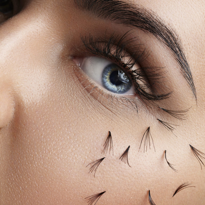 closeup of woman eye with falling lashes closeup of woman eye with falling lashes on cheek